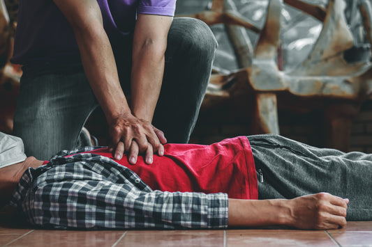 Manly Heart-Starter CPR course at Manly Library, hands performing chest compressions.